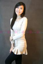 เดรสผ้ายืดแขนยาวสีครีมคอกลม แต่งระบายชายกระโปรง